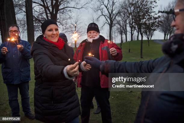 friends and family celebrating life of cancer patient outdoors winter - surrounding support stock pictures, royalty-free photos & images