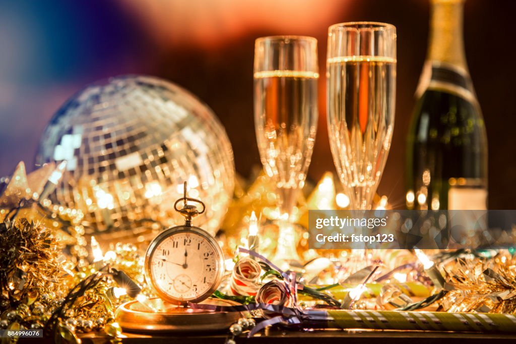 New Year's Eve holiday party, pocket watch, clock at midnight.