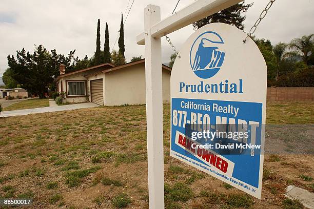 Realtor sign advertises a bank-owned house for sale as a new California law that imposes a 90-day moratorium on housing foreclosures takes effect...