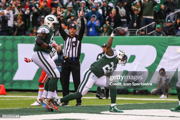 New York Jets running back Matt Forte spikes the football after scoring a touchdown during the National Football League game between the New York...