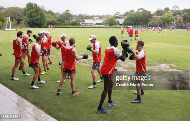 Players during a boxing drill at a Sydney Swans AFL pre-season training session at Weigall Sports Ground on December 4, 2017 in Sydney, Australia.