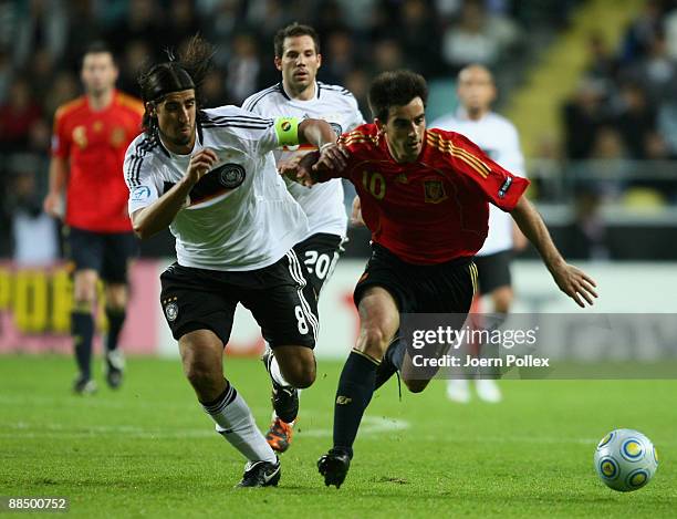 Sami Khedira of Germany and Jose Manuel Jurado of Spain battle for the ball during the UEFA U21 Championship Group B match between Spain and Germany...