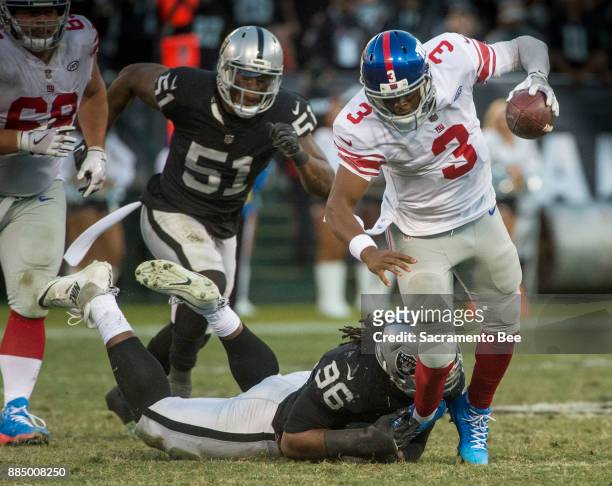 Oakland Raiders defensive end Denico Autry sacks New York Giants quarterback Geno Smith on Sunday, Dec. 3, 2017 at the Oakland-Alameda County...