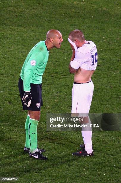 Tim Howard of USA berates team mate Jay DeMerit following Italy's third goal during the FIFA Confederations Cup Group B match between Italy and USA...