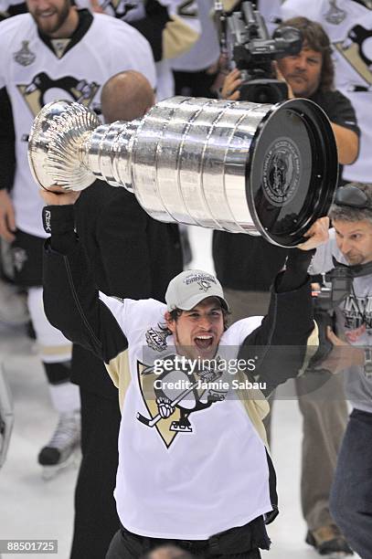 Sidney Crosby of the Pittsburgh Penguins celebrates with the Stanley Cup after the win against the Detroit Red Wings during Game Seven of the 2009...