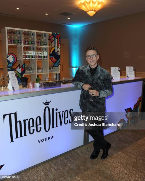 Tyler Oakley toasts with Three Olives Vodka in support of The Trevor Project at TrevorLIVE Gala at The Beverly Hilton Hotel on December 3, 2017 in...