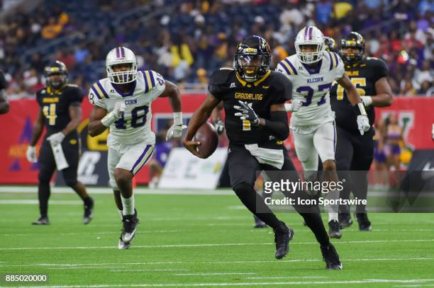 Grambling State Tigers quarterback Devante Kincade is flushed from the pocket for a moderate first half gain during the SWAC Championship football...