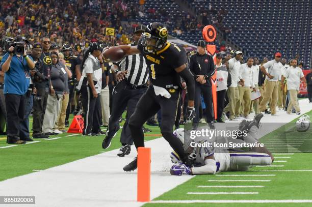 Grambling State Tigers quarterback Devante Kincade is forced out of bounds by Alcorn State Braves defensive back Javen Morrison during first half...