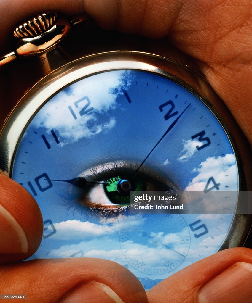 Pocket watch with reflection of sky and woman's eye (Digital Composite