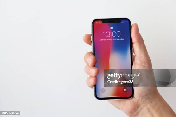 neue iphone x silber - iphone x hand stock-fotos und bilder