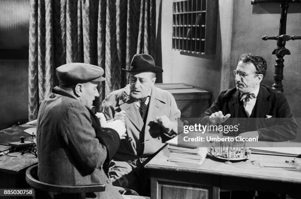 Italian actors Totò, Peppino De Filippo and Peppino De Martino acting during the shooting of 'La cambiale', an Italian comedy film directed by...