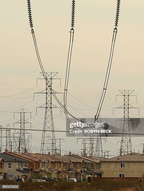 Homes on newer housing developments are located near powerlines in the high desert city of Victorville, California on June 15 the first day of a...