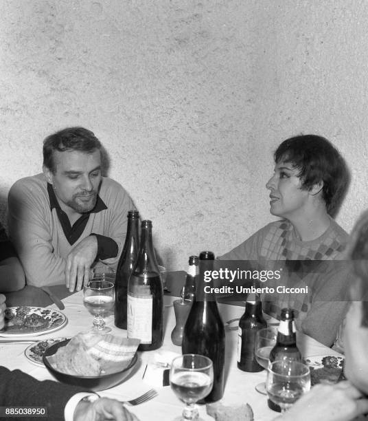 Italian actor Giorgio Albertazzi is having lunch with Italian actress Anna Proclemer at the Cucurucu restaurant, Rome 1966.