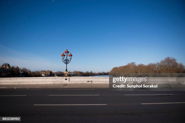 a view of the putney bridge with victorian lamp post in the morning - putney london stock pictures, royalty-free photos & images