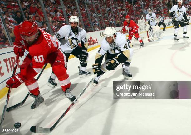 Rob Scuderi of the Pittsburgh Penguins defends against Henrik Zetterberg of the Detroit Red Wings during Game Seven of the 2009 NHL Stanley Cup...