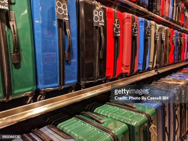 luggage in a store - luggage rack stock-fotos und bilder