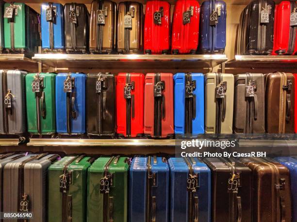 order luggage. shelving luggage. - luggage rack stock pictures, royalty-free photos & images