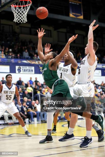 Cleveland State Vikings Kasheem Thomas throws up a shot as he drives to the basket against Kent State Golden Flashes center Adonis De La Rosa and...