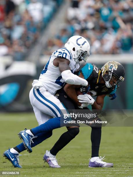 Wide Receover Dede Westbrook of the Jacksonville Jaguars is forced out of bounce by Safety Darius Butler of the Indianapolis Colts during the gameat...