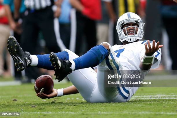 Quarterback Jacoby Brissett of the Indianapolis Colts looks at the officials for a roughing call during the game against the Jacksonville Jaguars at...