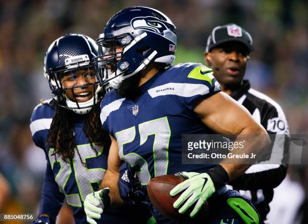 Linebacker Michael Wilhoite of the Seattle Seahawks celebrates the Eagles touchback with Shaquill Griffin with in the third quarter at CenturyLink...