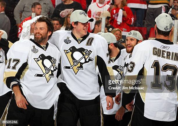 Evgeni Malkin and Petr Sykora of the Pittsburgh Penguins celebrate after defeating the Detroit Red Wings by a score of 2-1 to win Game Seven and the...