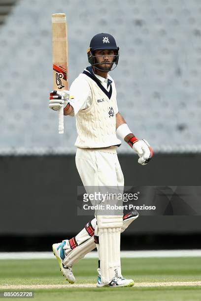 Glenn Maxwell of Victoria celebrates his half century during day two of the Sheffield Shield match between Victoria and Western Australia at...