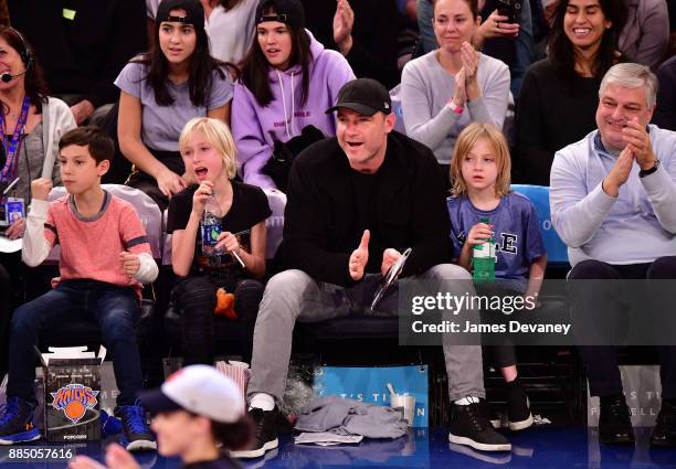 Alexander Schreiber, Liev Schreiber and Samuel Schreiber attend the Orlando Magic Vs New York Knicks game at Madison Square Garden on December 3,...