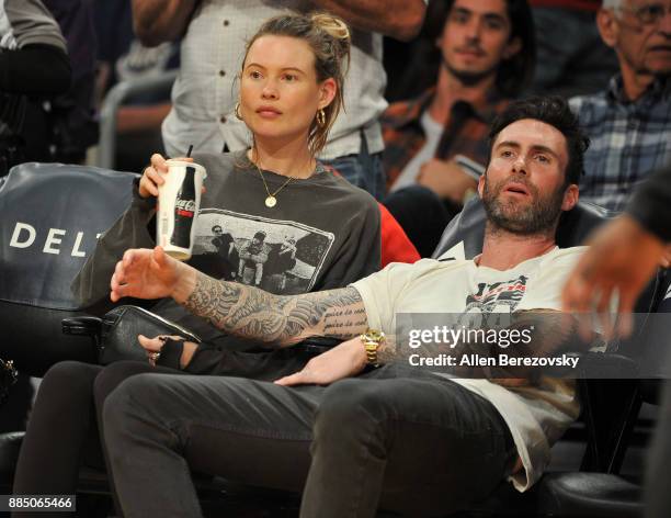 Singer Adam Levine and model Behati Prinsloo attend a basketball game between the Los Angeles Lakers and the Houston Rockets at Staples Center on...