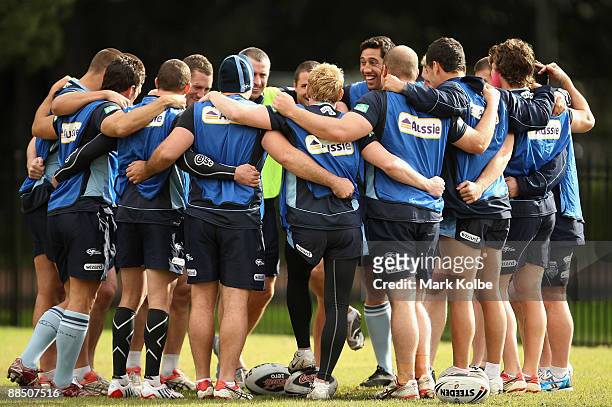 The Blues team form a huddle before the start of their New South Wales Blues State of Origin training session at Sydney Football Stadium on June 16,...