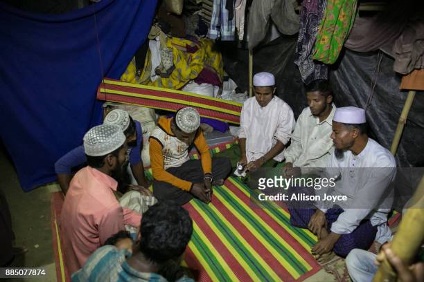 Munir sits segregated from his bride , Amina Begum and other women during his marriage ceremony in a Bangladesh refugee camp November 25, 2017 in...