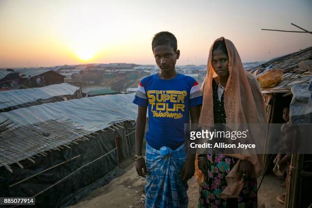 Year old Hashimullah poses for a photo with his new bride, 16 year old Farmina Begum on the day of their wedding in a Bangladesh refugee camp...