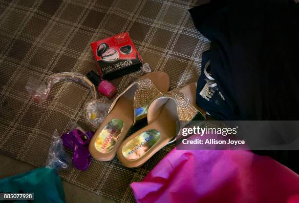 Shoes and makeup belonging to Nur Begum, who doesn't know her age but thinks she is between 14 and 16 years old, are seen on the day of her wedding...