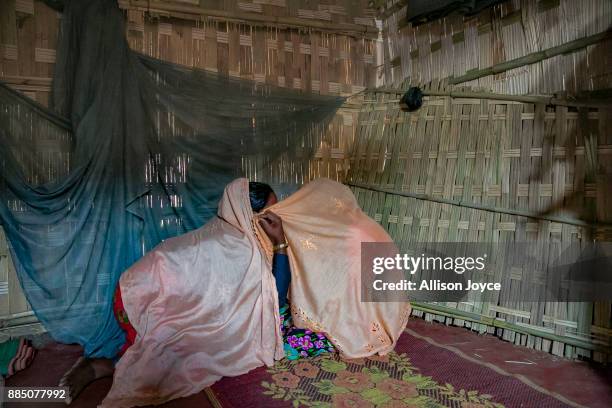 Farmina Begum talks to her friend on the day of her wedding to 18 year old Hashimullah, in a Bangladesh refugee camp November 27, 2017 in Cox's...
