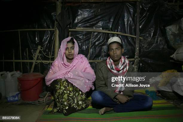 Nur Begum, who doesn't know her age but thinks she is between 14 and 16 years old, poses for photo with her new husband, Rayeed Alam on the day of...