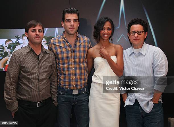 Writer Roberto Orci, actor Zachary Quinto, actress Zoe Saldana and director J.J. Abrams attend the "Star Trek" press conference at the Four Seasons...