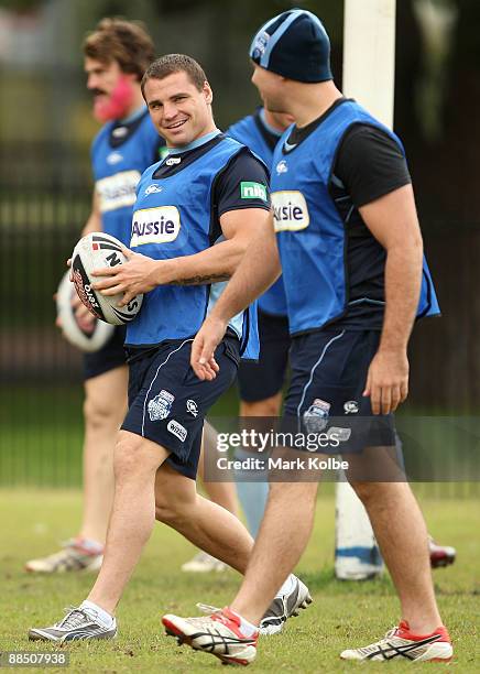 Anthony Watmough shares a laugh with Glenn Stewart during a New South Wales Blues State of Origin training session at Sydney Football Stadium on June...