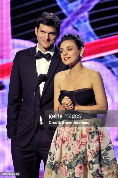 Actors Ashton Kutcher and Mila Kunis speak onstage during the 2018 Breakthrough Prize at NASA Ames Research Center on December 3, 2017 in Mountain...