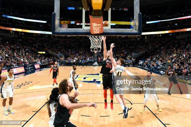 Lauri Markkanen of the Chicago Bulls shoots over Juan Hernangomez of the Denver Nuggets at Pepsi Center on November 30, 2017 in Denver, Colorado.