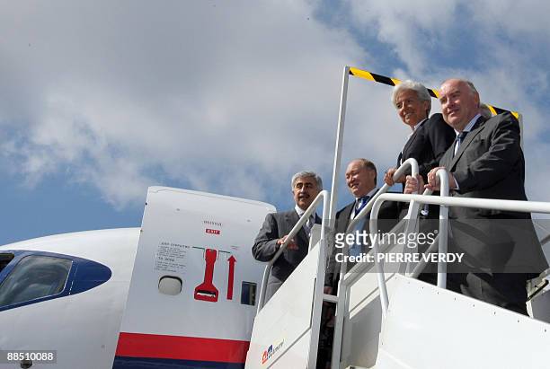 Russian plane maker Sukhoi CEO Mikhail Pogosyan and Russian's Deputy Prime Minister Sergei Sobyanin waits for French Economy Minister Christine...