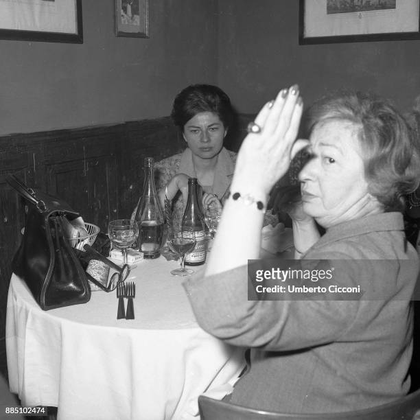 Soraya with her mother eating at the famous place 'San Callisto', Rome 1963.