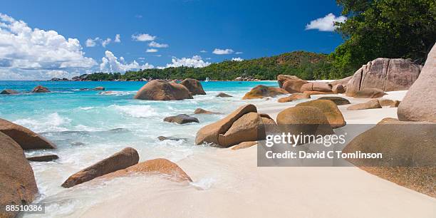 rocky shore, anse lazio, praslin, seychelles - seychellen stock-fotos und bilder