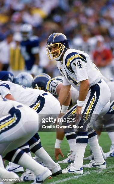 Dan Fouts of the San Diego Chargers takes the snap against the Dallas Cowboys at Jack Murphy Stadium circa 1986 in San Diego,California on November...