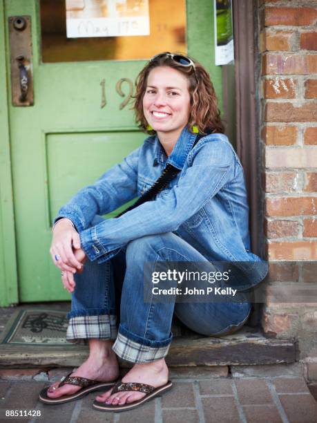 woman sitting in doorway - carbondale colorado bildbanksfoton och bilder