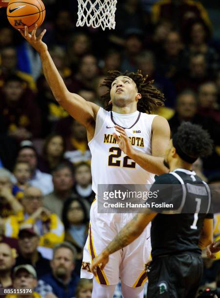 Reggie Lynch of the Minnesota Golden Gophers shoots the ball against Mike Cunningham of the USC Upstate Spartans during the game on November 10, 2017...