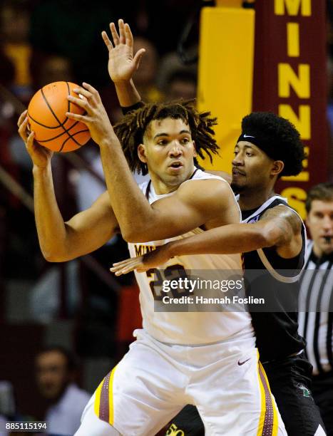 Ramel Thompkins of the USC Upstate Spartans defends against Reggie Lynch of the Minnesota Golden Gophers during the game on November 10, 2017 at...