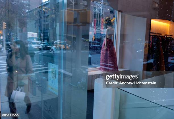 High-end luxury stores on Madison Avenue attract shoppers during the Christmas season able to afford the expensive prices on December 1, 2017 in the...