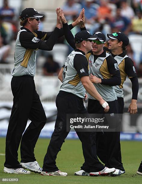 Jacob Oram of New Zealand is congratulated by his team mates after taking the wicket of Chamara Silva of Sri Lanka during the ICC World Twenty20...