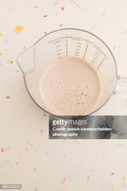 stout in measuring cup. - water in measuring cup stock pictures, royalty-free photos & images