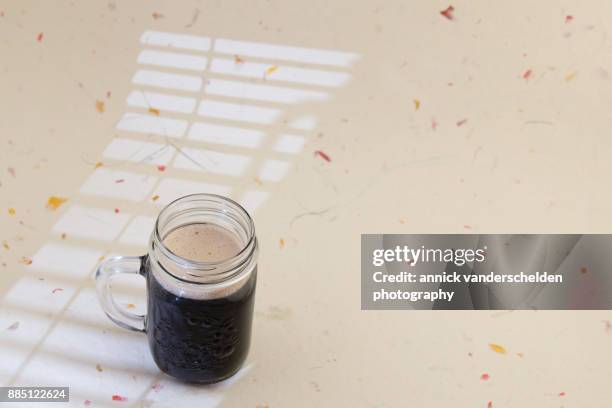 stout in a jar. - water in measuring cup stock pictures, royalty-free photos & images